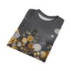 Golden, white, and brown floral shapes with textured dots cover this sublimation graphic tee, depicting a modern art nature scene with a hazy background.