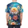 Vibrant blues and greens with large yellow, pink, and purple flowers, alongside delicate foliage and sparkling accents cover this graphic streetwear tee.