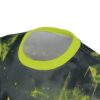 Bold lime green and black abstract geometric shapes and splatter patterns cover this full print t-shirt.