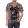 Pink poppies and green leaves cover this full print shirt, with a black cat with green eyes and a cube-shaped head in the center.