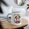 White ceramic mug with a blue handle, featuring a cartoon sloth peeking out of a pumpkin that says 