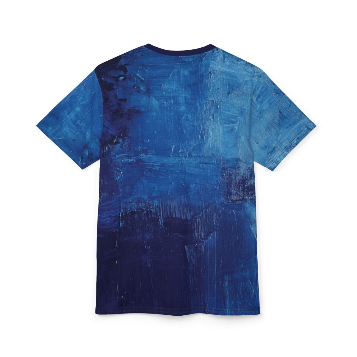 Deep and light blue brush strokes cover this patterned tee shirt, with a textured, painted effect throughout.
