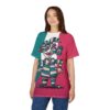 A young woman wearing a t-shirt with an abstract, colorful character design against a plain white background.