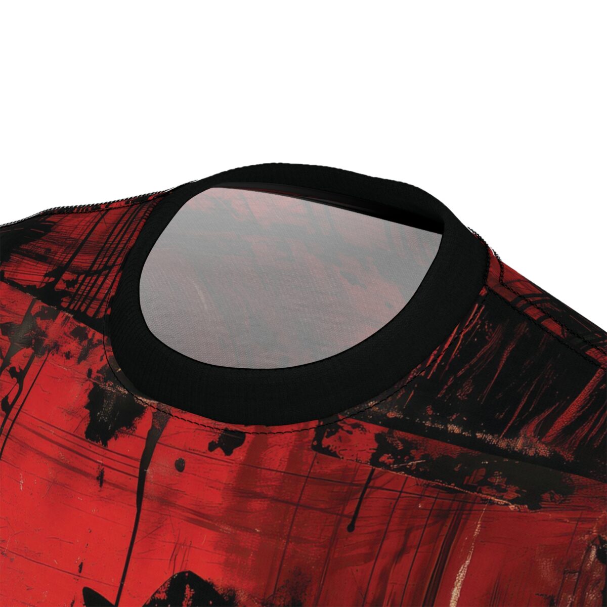 Close-up view of the collar and shoulder area of a t-shirt with an abstract grunge pattern. The pattern features vibrant red and black colors with a distressed, splattered, and streaked texture, resembling brush strokes or paint drips.