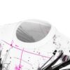 White fabric with black ink splatters, thin pink lines, and abstract black graphic elements depicting fragmented shapes.