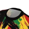 Bold red, yellow, and green abstract brush strokes cover this oversized full print tee, creating a vibrant Rasta-inspired pattern.