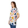 Red, blue, yellow, and black abstract shapes, dots, and lines cover this 3D graphic t-shirt.