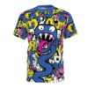 Colorful all over print t-shirt with abstract graffiti monsters and a large blue creature with a long pink tongue.