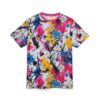 Splashes of pink, yellow, and blue paint, along with black lines and dots, cover this patterned tee shirt.
