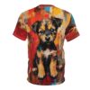 A t-shirt featuring a painted image of a small, scruffy puppy with large, expressive eyes sitting against an abstract, colorful background with strokes of red, yellow, blue, and brown.