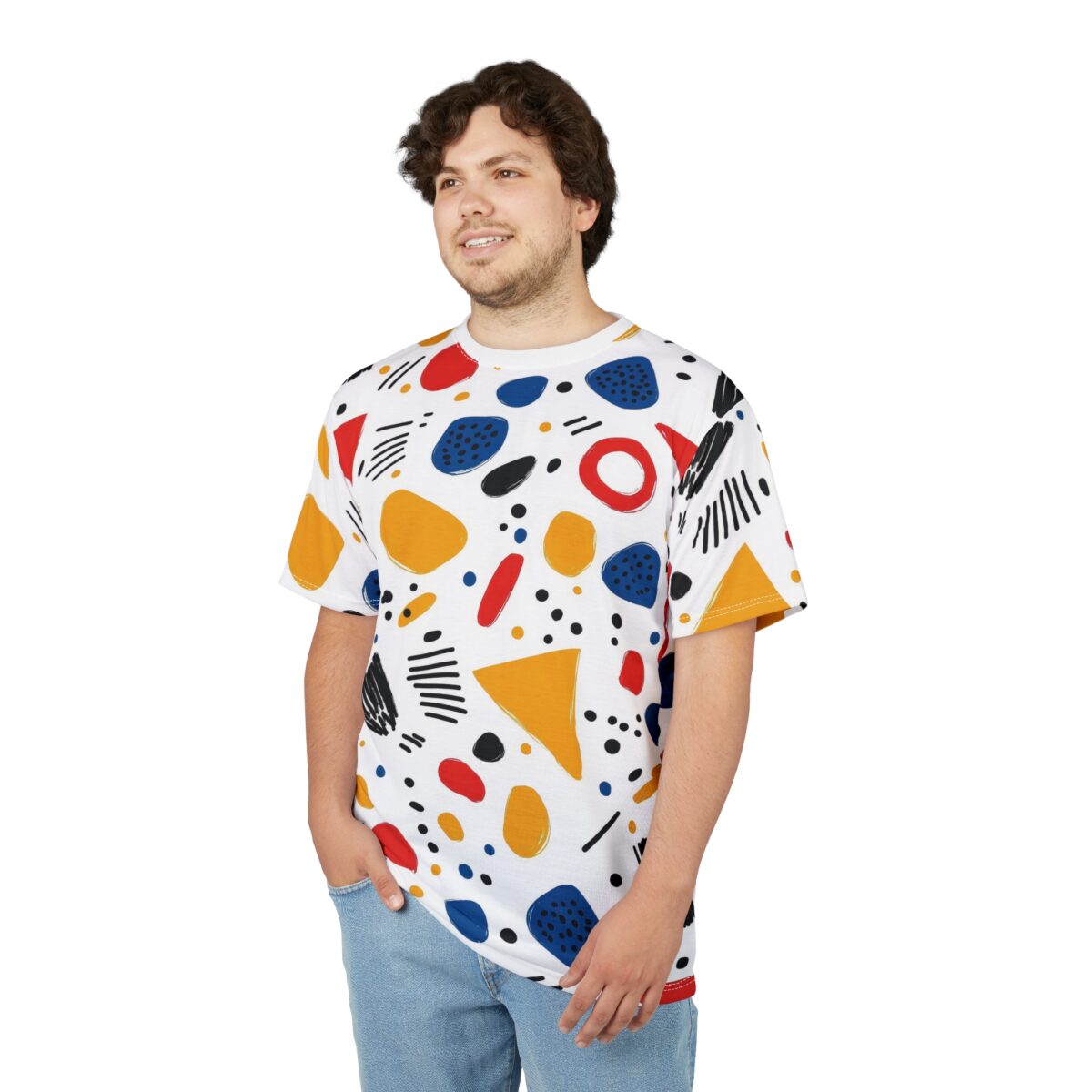 White crewneck t-shirt with a vibrant, all-over abstract pattern of colorful shapes including red ovals, blue blobs, yellow teardrops, black dots, and black lines.
