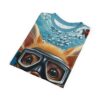 A folded t-shirt featuring a cartoon fox-like animal wearing black diving goggles underwater, with bubbles and a blue background.