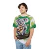 Koala playing ukulele, green palm leaves, all over print, sublimation tee