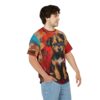 A young man wearing a t-shirt with a colorful abstract painting of a cute puppy on it.