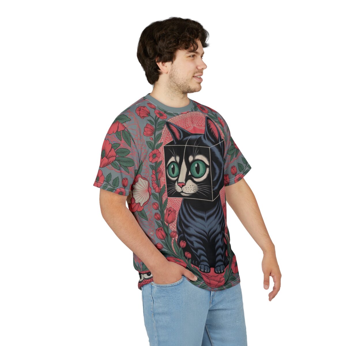 Red flowers and green leaves cover this patterned tee shirt, with a black cat centered on a geometric background.