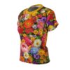 Vibrant floral all over print sublimation tee featuring a dense arrangement of colorful flowers like roses, peonies, and daisies with a yellow collar.