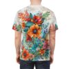 Vibrant orange, red, and pink flowers with lush green leaves cover this patterned tee shirt, set against a soft, watercolor-like background.