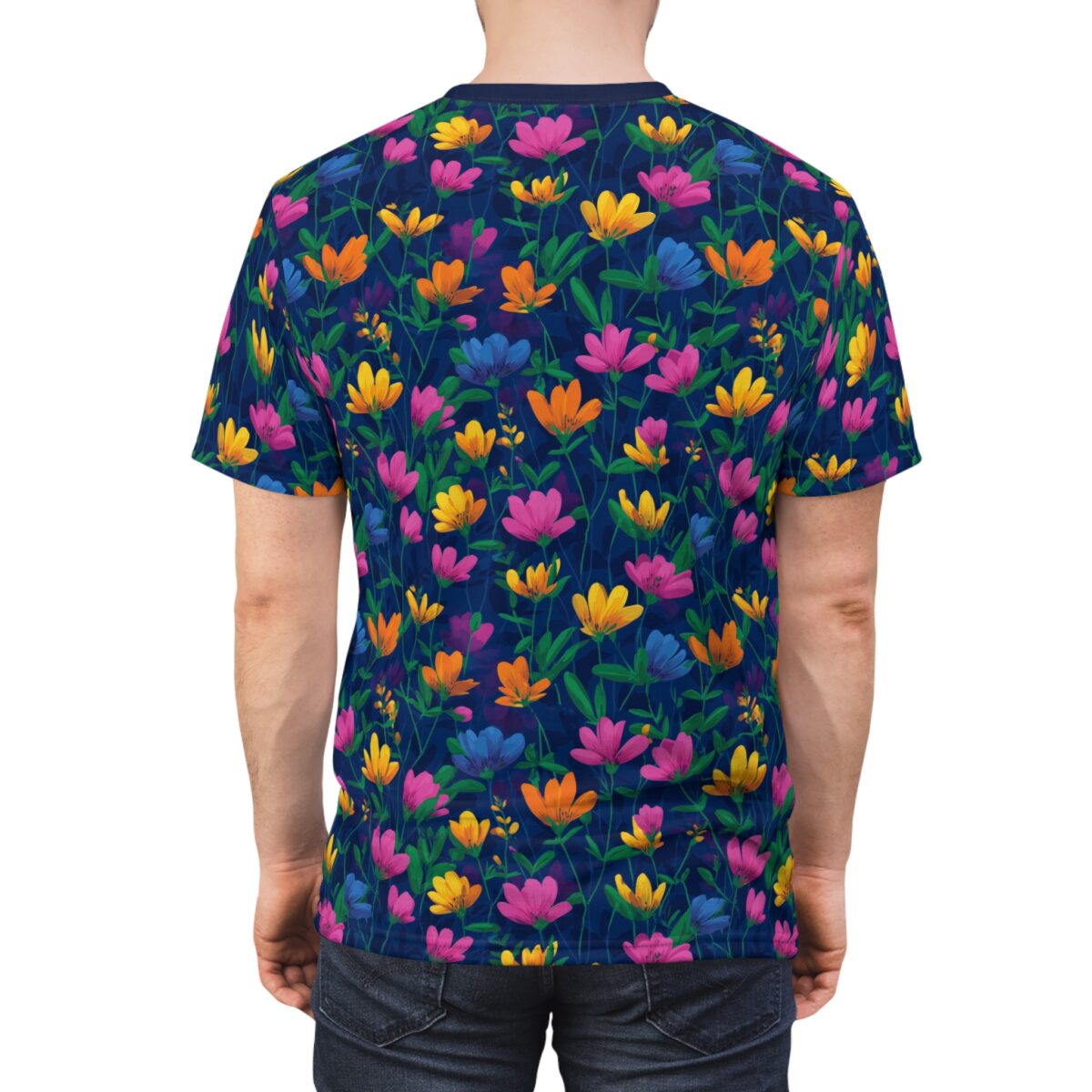All over print t-shirt with vibrant floral pattern in pink, yellow, and blue on a dark navy background. Vintage pattern sublimation tee.