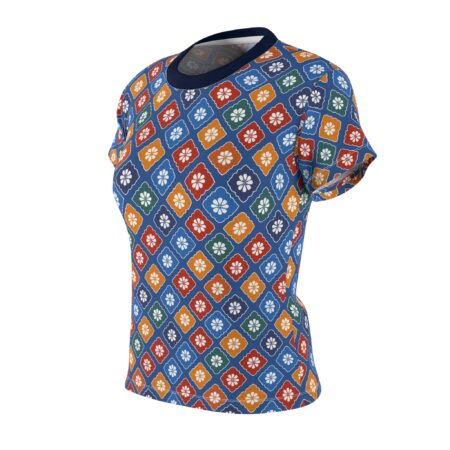 Blue all over print sublimation tee with a seamless vintage pattern of diamond-shaped tiles containing white flowers in red, orange, green, and blue.