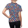 Blue all over print t-shirt with geometric floral pattern in red, white, green, and orange squares.