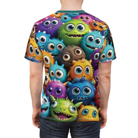 Vibrant purple, green, blue, orange, and brown fuzzy monsters with wide eyes and playful grins cover this oversized full print tee, creating a whimsical and energetic pattern.