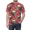 Vintage skulls on a red background with green and yellow polka dots cover this patterned tee shirt.