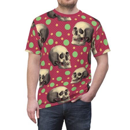 Vintage skulls on a red background with green and yellow polka dots cover this patterned tee shirt.