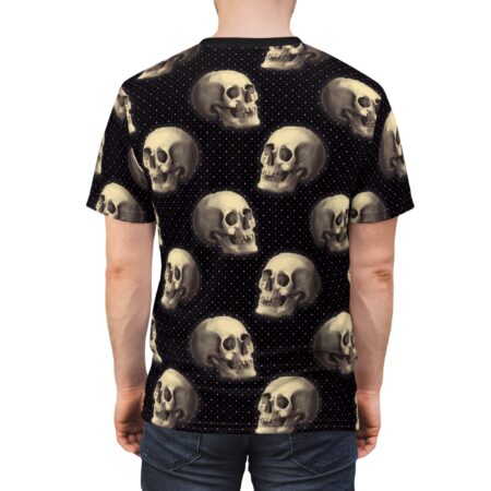 Cream-colored skulls and pink polka dots cover this all over print apparel, detailed anatomical skulls on a black background.