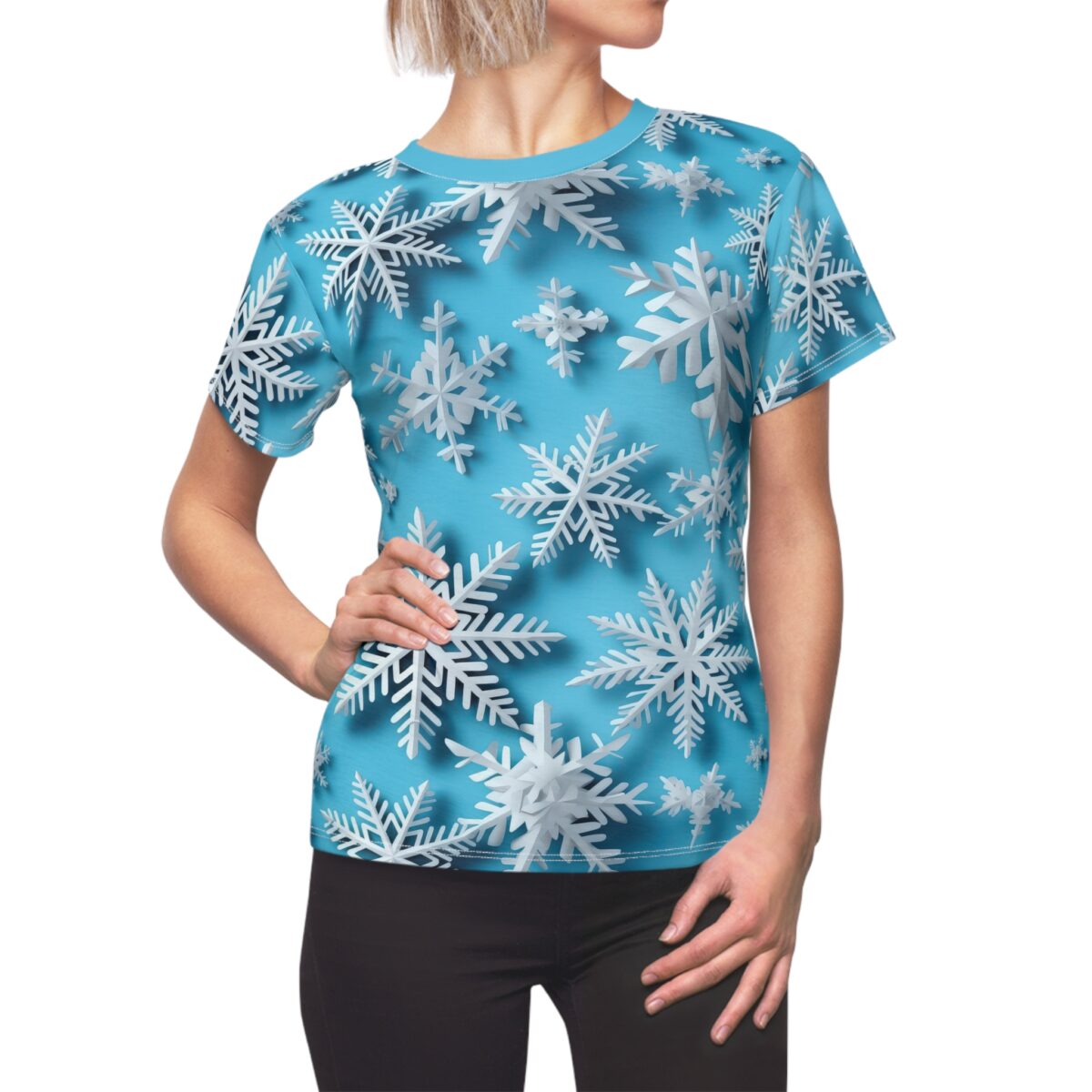 All over print t-shirt featuring a seamless wrap around graphic of white snowflakes on a bright blue background.