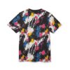 Vivid pink, yellow, and blue paint splatters with white streaks cover this sublimation graphic tee, set against a black background.