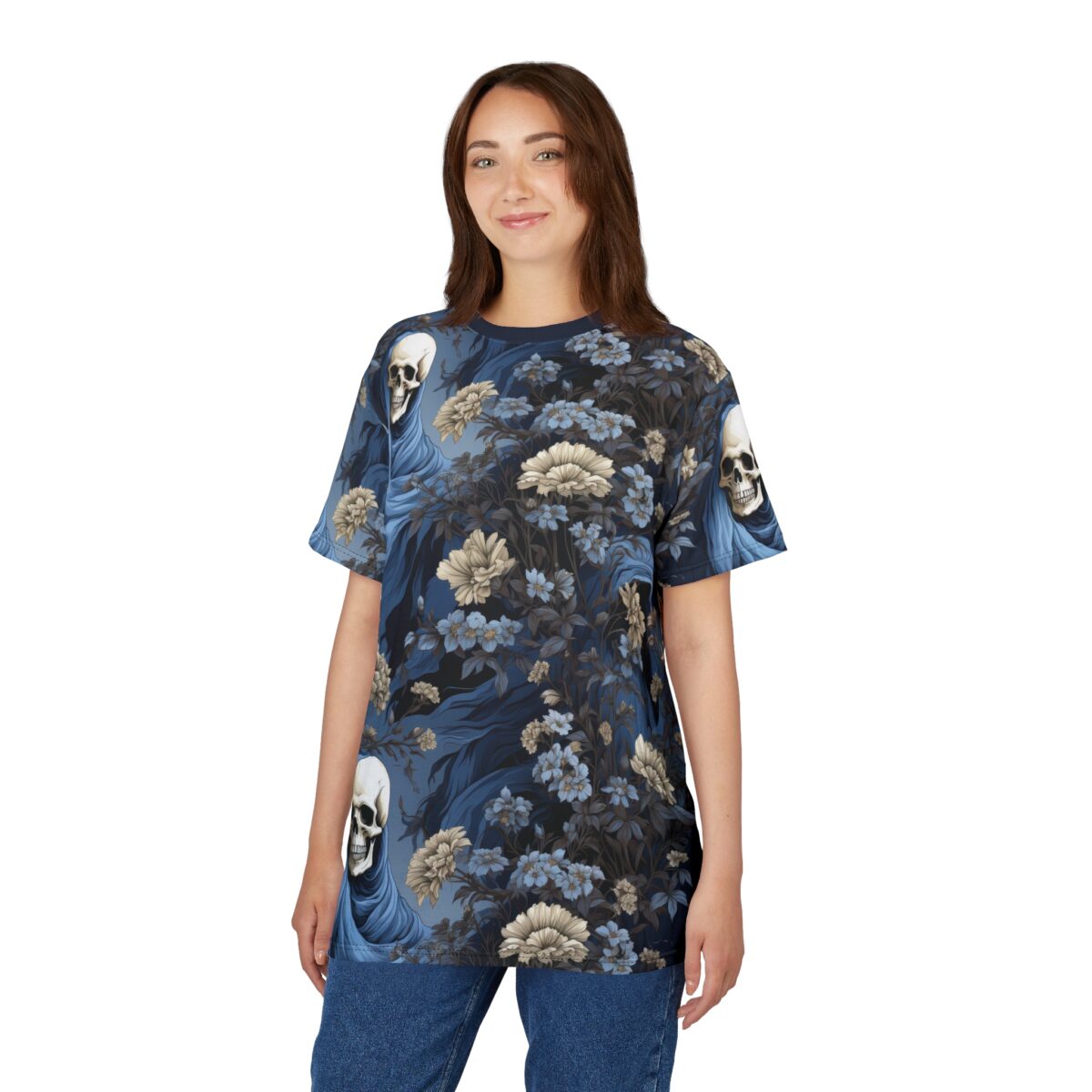 Dark blue and tan flowers and skulls wearing blue hoods cover this patterned tee shirt, with flowing dark blue fabric elements.