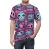 Purple and pink hues cover this sublimation graphic tee, depicting a chaotic pattern of cartoon zombie faces with stitched mouths and big, pink-eyed skulls.