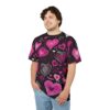 Pink and white hearts of various sizes and styles cover this black t-shirt, with dotted lines and swirls in the background.
