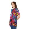 Pink, blue, yellow, and purple paint splatters overlay a black and white abstract background on this all over print t-shirt.