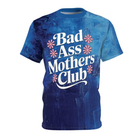 Deep blues with textured brushstrokes cover this graphic t-shirt, featuring white text that reads "Bad Ass Mothers Club" surrounded by pink asterisks.