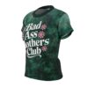 Dark green distressed textures cover this all over print apparel, highlighting bold white text and pink floral accents.