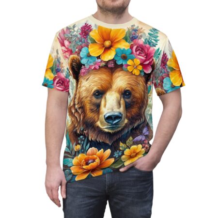 Vibrant floral patterns in pink, yellow, blue, and orange cover this 3D graphic t-shirt, depicting a bear with a flower crown and butterflies.