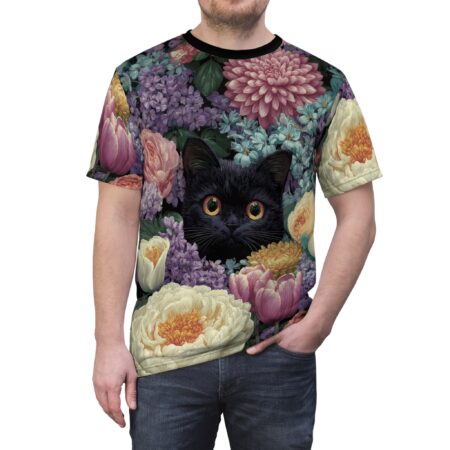 Vibrant pink, purple, and yellow flowers surround a black cat with striking orange eyes on this graphic t-shirt.