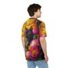 Vibrant orange and yellow leaves, dark tree trunks, and a black cat with orange eyes are depicted on this all over print tee.