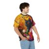 Vibrant orange and yellow leaves with a black cat and colorful floral accents cover this full print shirt.