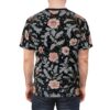 Black background with pink flowers and grey leaves, a flowing floral vine design covers this graphic t-shirt.