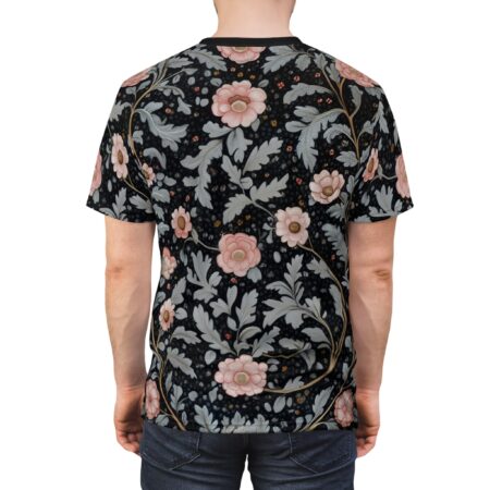 Black background with pink flowers and grey leaves, a flowing floral vine design covers this graphic t-shirt.