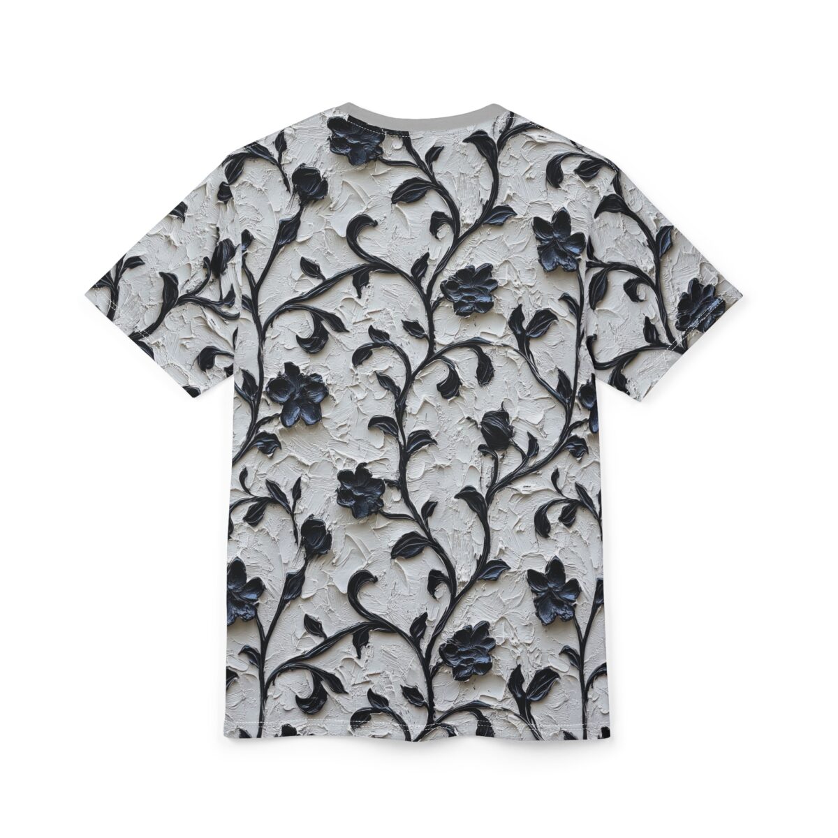 Black floral vines and textured petals cover this sublimation graphic tee, with a textured background.