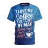 Brushstroke textures in various shades of blue cover this sublimation graphic tee, with white and pink text and a coffee cup design.