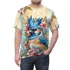 A blue jay surrounded by pink and blue flowers, with a yellow floral pattern on a sublimation graphic tee.