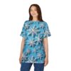 White 3D snowflakes cover this blue patterned tee shirt, creating a winter scene with shadows.