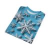 White, three-dimensional snowflakes cover this bright blue all over print t-shirt, giving a festive winter feel.