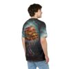 A man seen from the back, wearing a t-shirt. The t-shirt features a graphic print of a dark, eerie forest scene. In the foreground, a monstrous, skeletal hand with sharp nails is holding a large, double-patty cheeseburger. The cheese is melted and dripping down the sides of the burger, adding a grotesque yet appetizing element. The hand is adorned with ornate, dark metal rings. The overall aesthetic is gothic and darkly humorous.