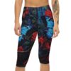 Capri leggings with a detailed all-over print of bright blue butterflies and deep red roses against a dark, leafy background.