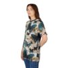 Teal and cream butterflies and floral blossoms cover this seamless pattern tee, set against a soft, textured background.